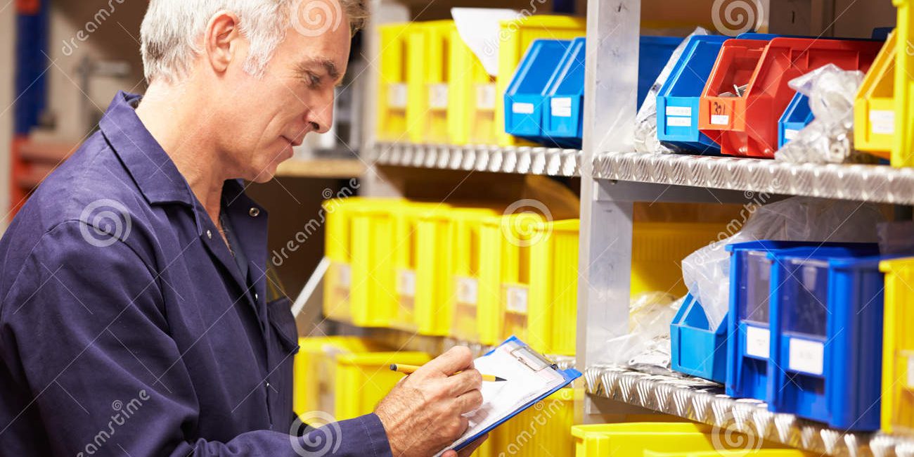 worker-checking-stock-levels-store-room-holding-clipboard-pen-34160183