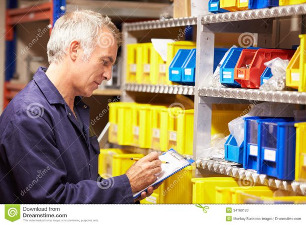 worker-checking-stock-levels-store-room-holding-clipboard-pen-34160183